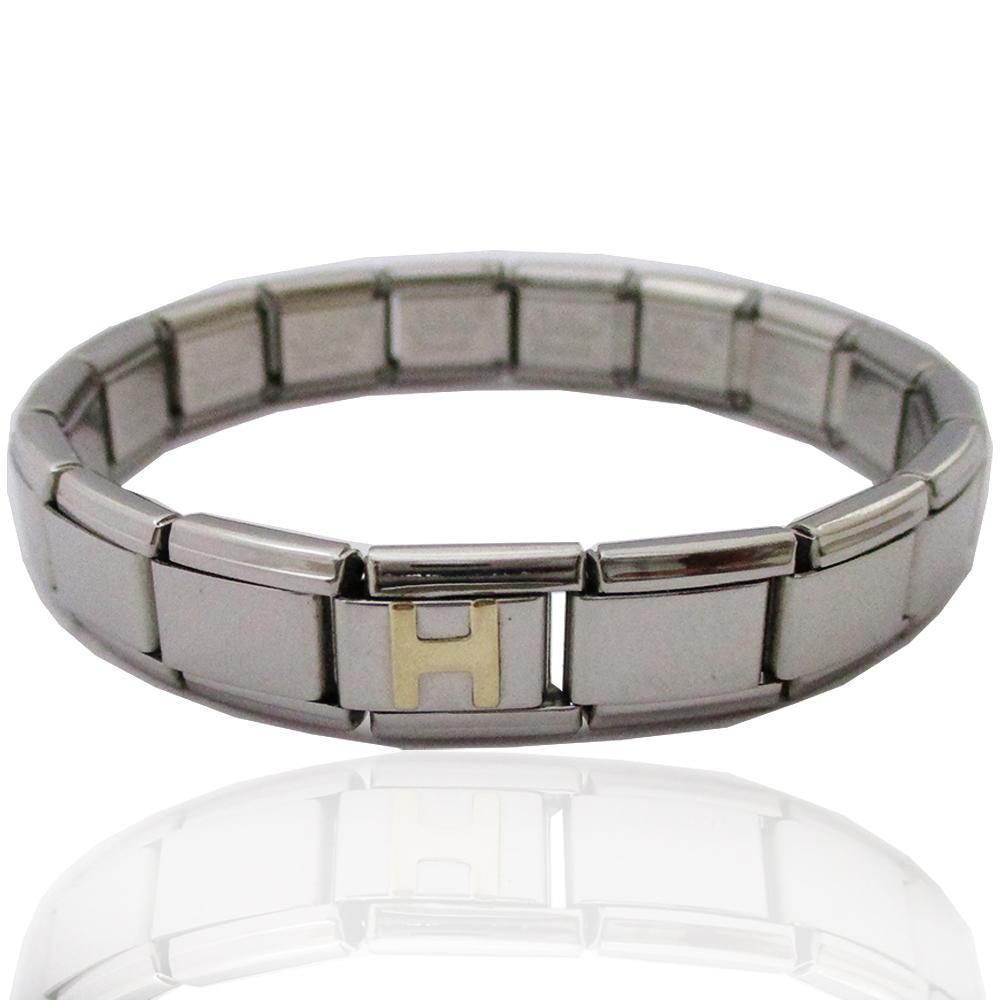 Bracciale estensibile in acciaio anallergico con iniziale h in oro giallo 18 carati