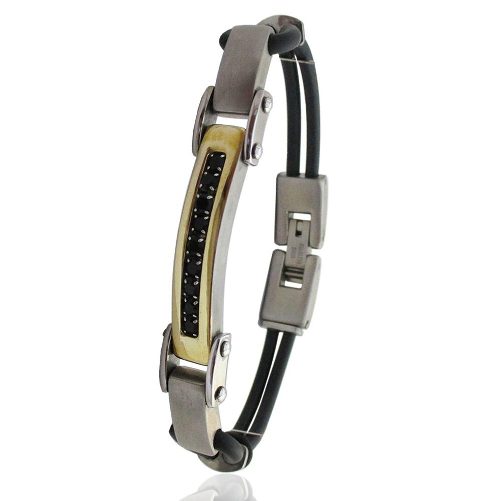 Bracciale caucciù a 2 fili con targa in acciaio satinato laminato oro e zirconi neri 