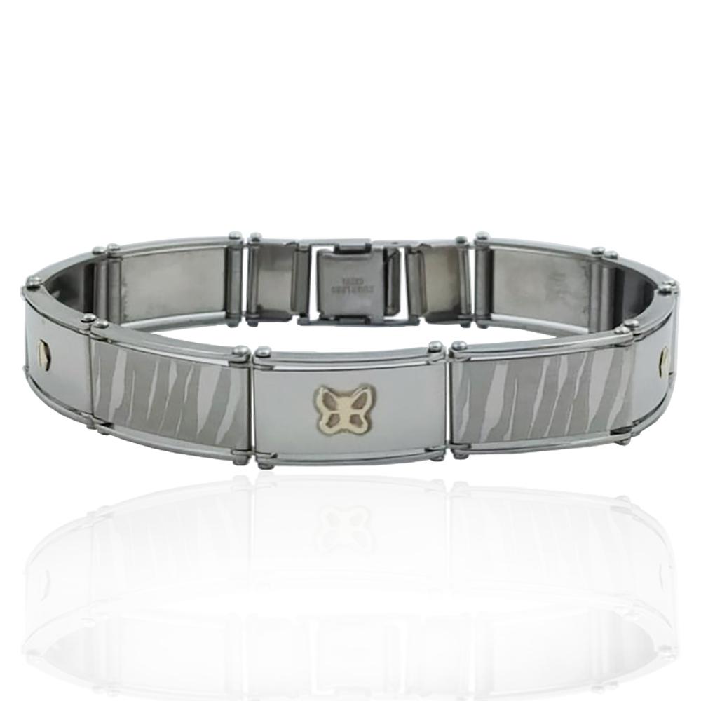 Bracciale in acciaio maglia a binario leopardata con applicazioni borchie e farfalla in oro giallo 18k