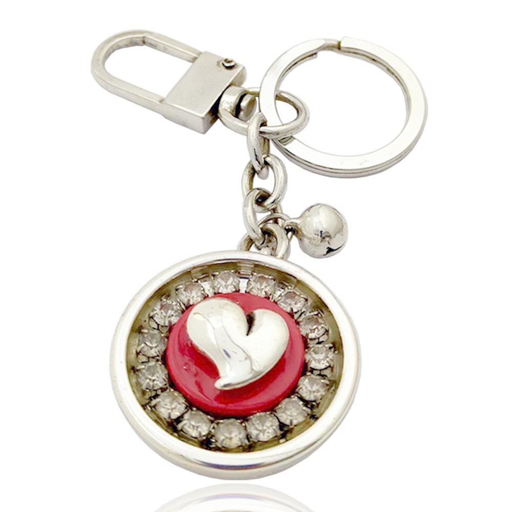 Portachiavi amore laminato argento con sonaglino e strass bianchi 